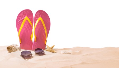 Photo of Pink flip flops, starfish, sea shell and sunglasses on sand against white background