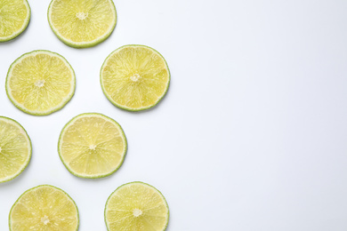 Fresh juicy lime slices on white background, top view