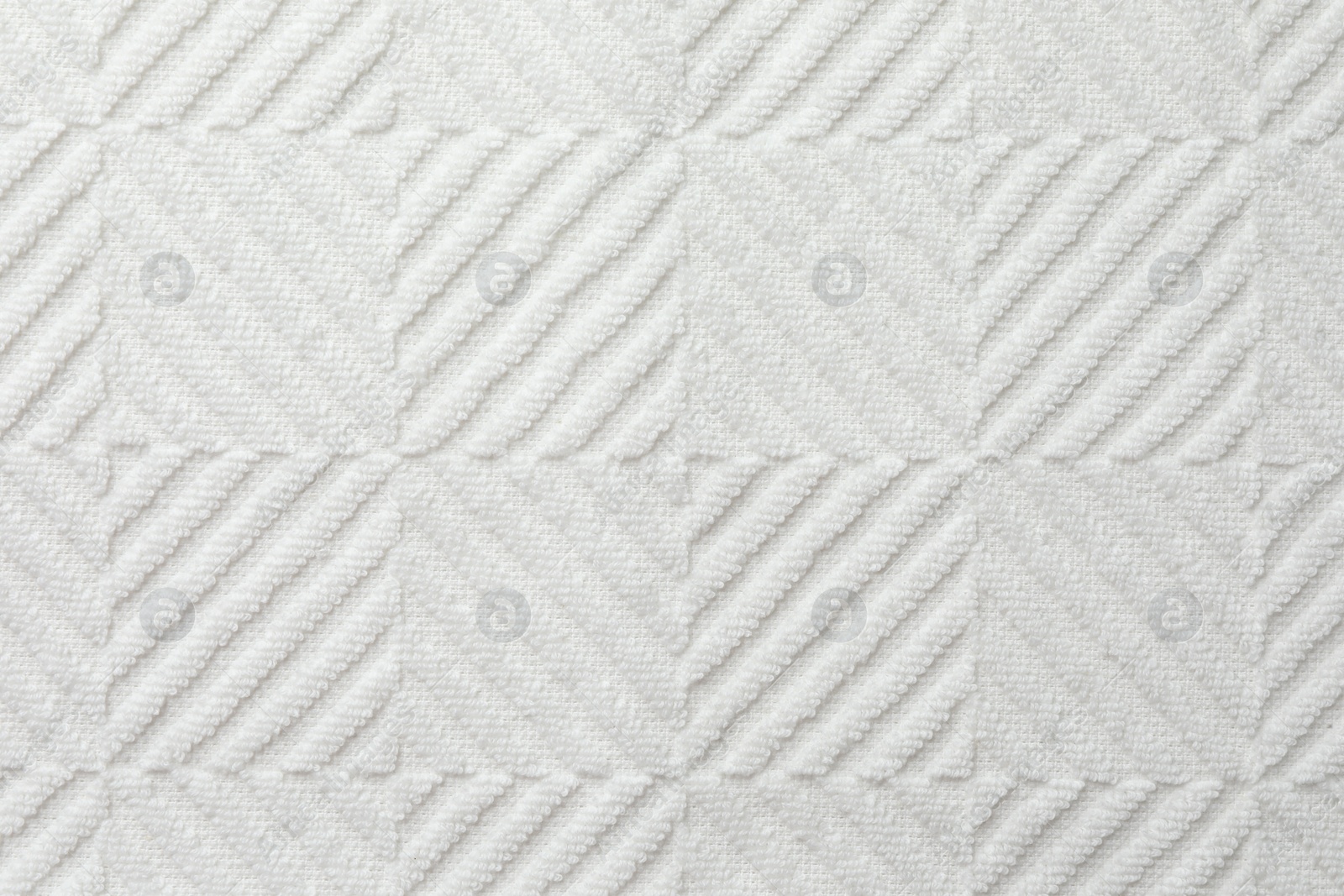 Photo of Texture of white fabric as background, top view