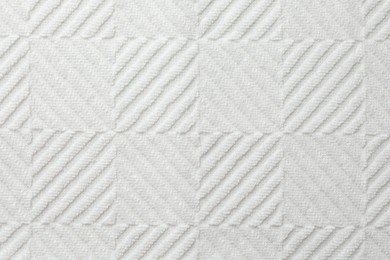 Texture of white fabric as background, top view