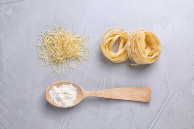 Flat lay composition with pasta on light grey table