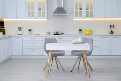 Photo of Beautiful kitchen interior with new stylish furniture