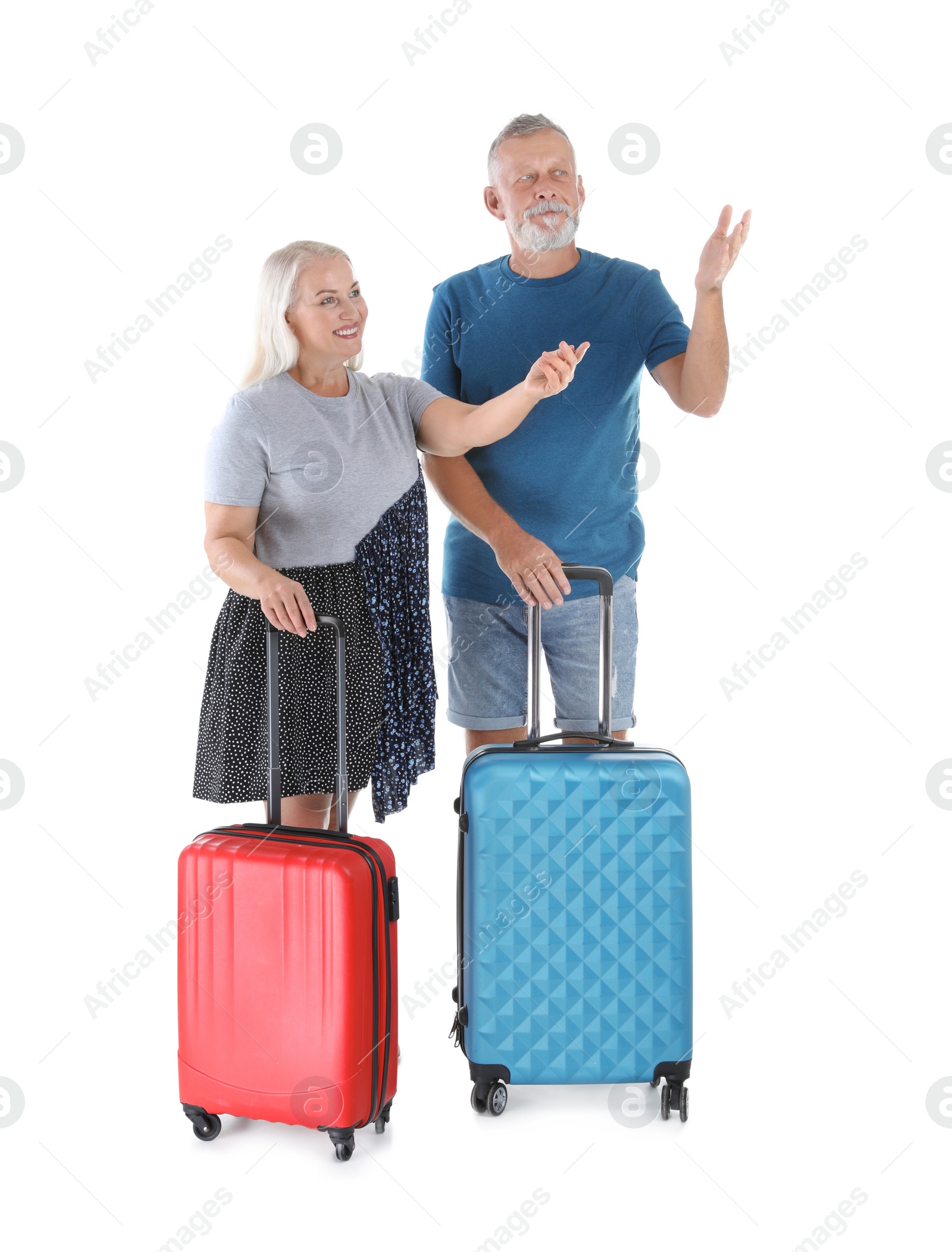 Photo of Senior couple with suitcases on white background. Vacation travel