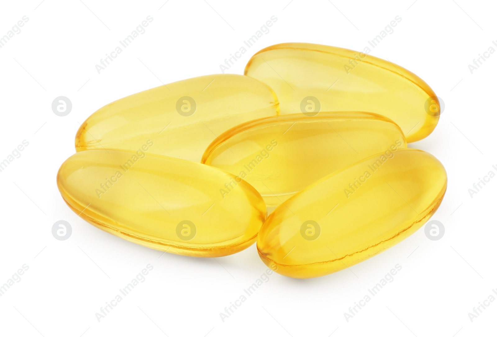 Photo of Many yellow vitamin capsules isolated on white