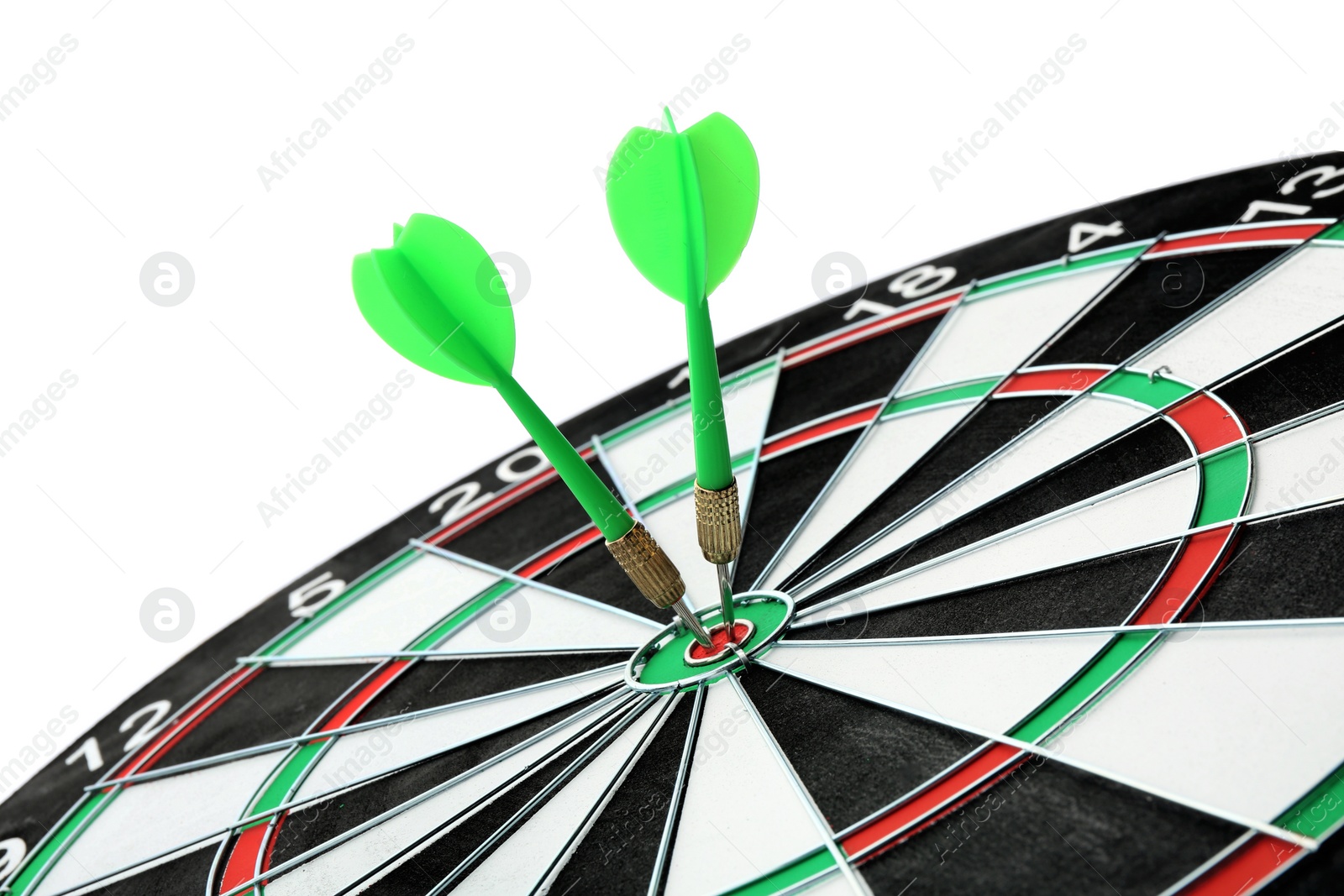 Photo of Dart board with color arrows hitting target, closeup