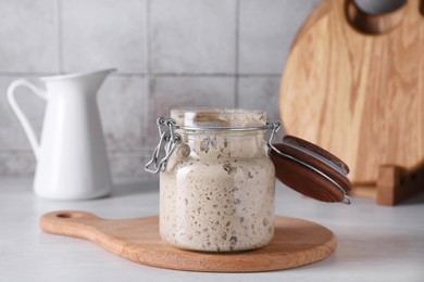 Photo of Sourdough starter in glass jar on light table