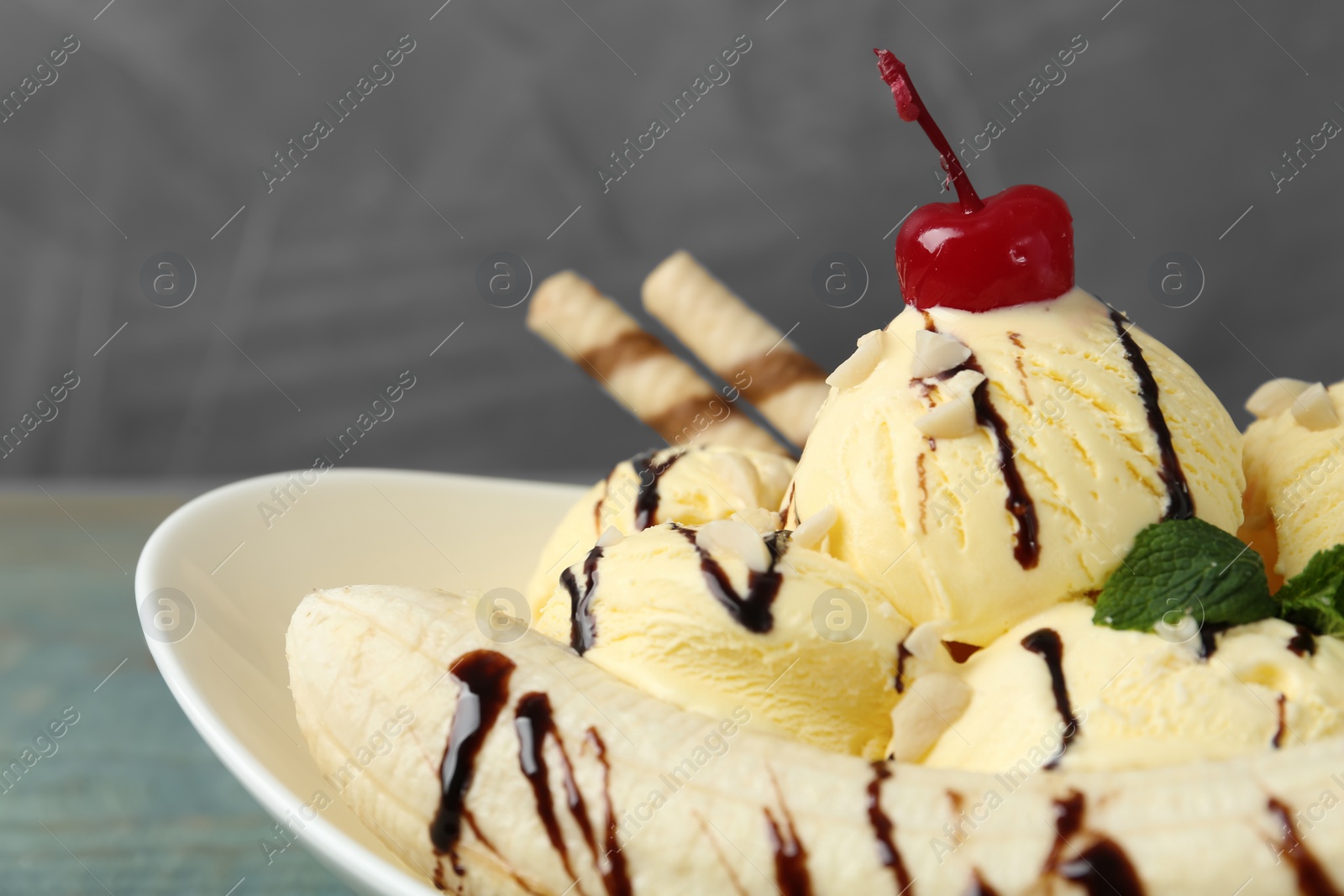 Photo of Delicious dessert with banana ice cream on table, closeup