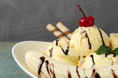 Delicious dessert with banana ice cream on table, closeup