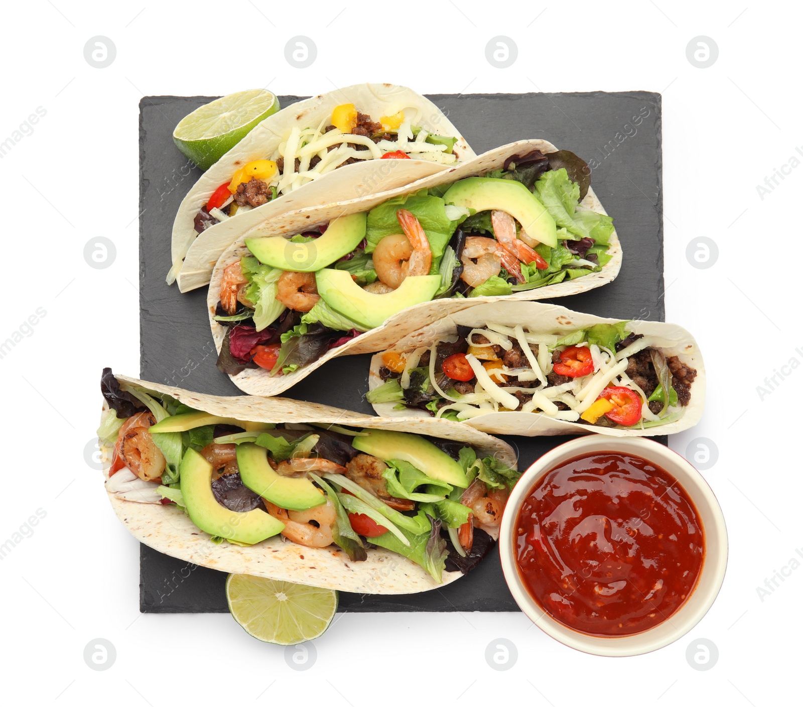 Photo of Delicious tacos, lime and sauce on white background, top view