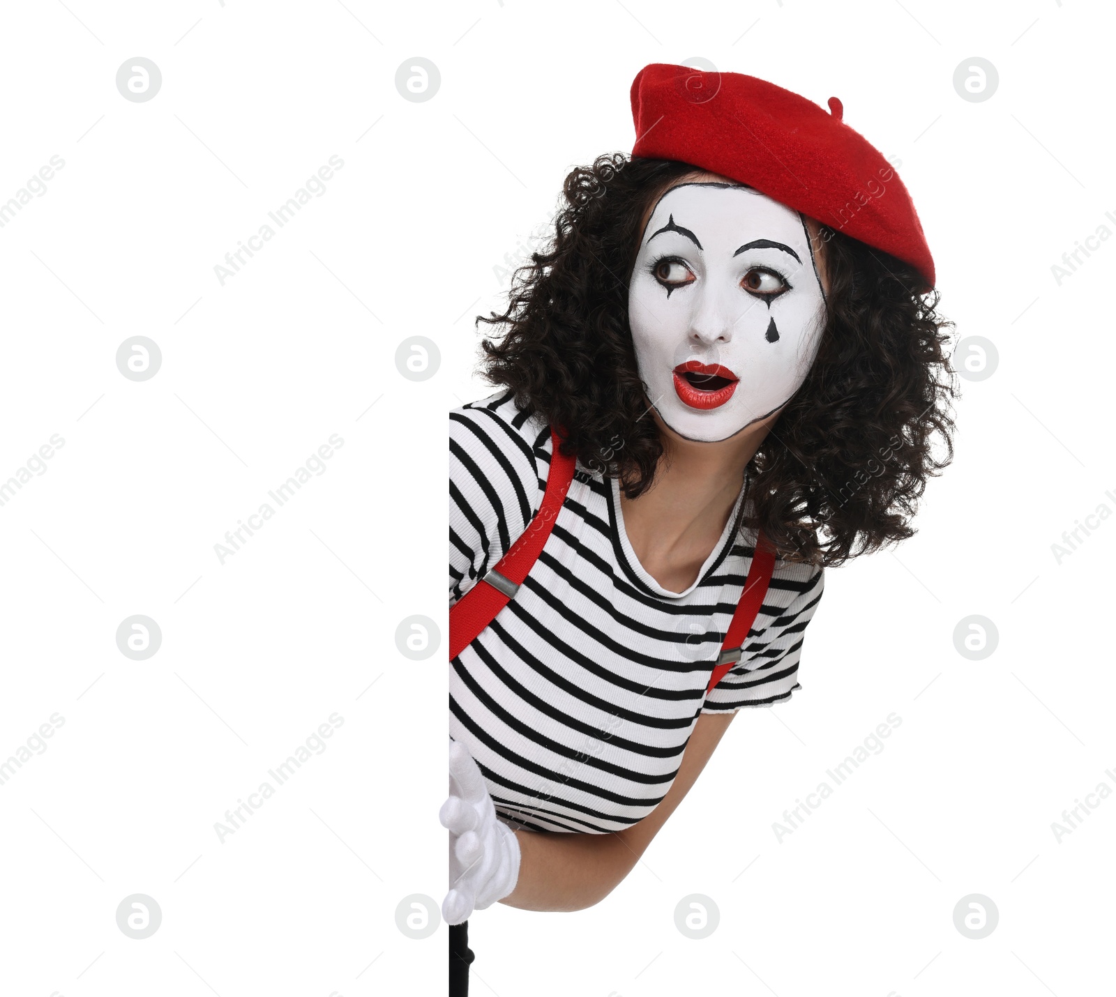 Photo of Funny mime with blank poster posing on white background