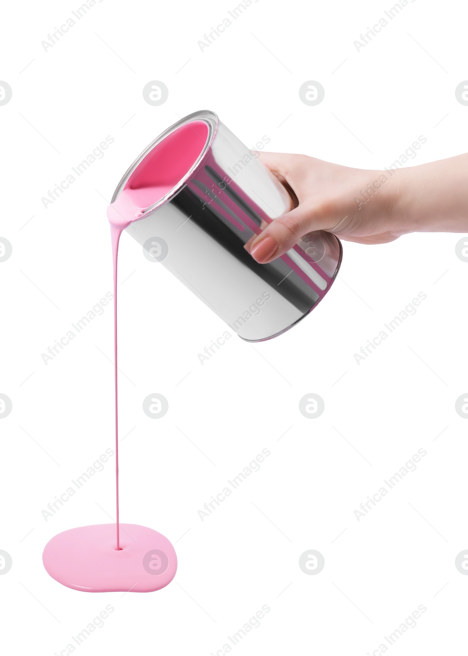 Photo of Woman pouring pink paint from can on white background, closeup