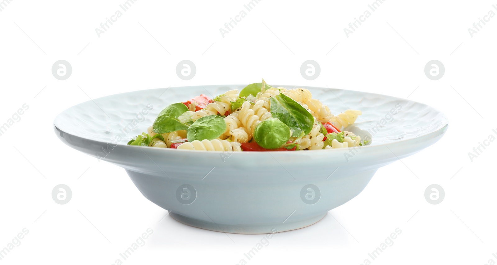 Photo of Tasty pasta salad with basil and fresh tomatoes on white background