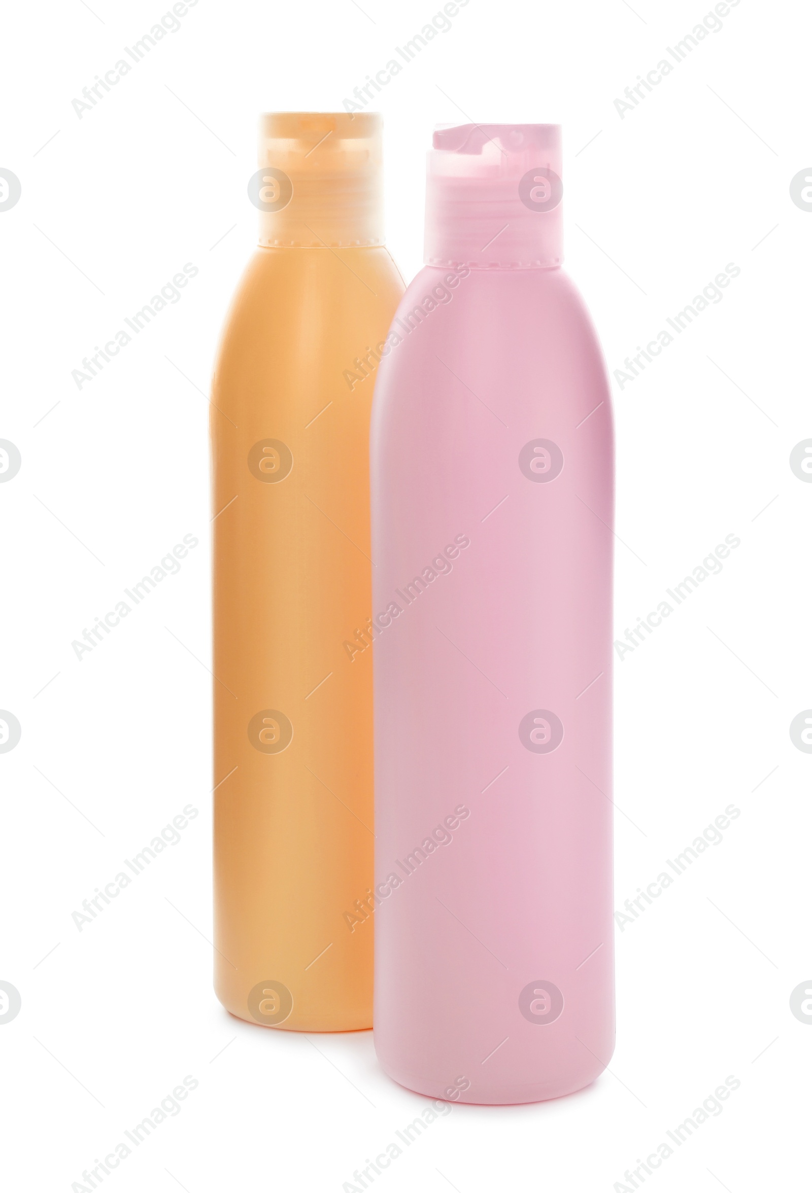 Photo of Bottles with cosmetic products on white background. Mockup for design