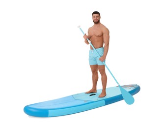 Happy man with paddle on blue SUP board against white background