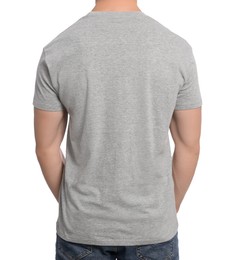 Man wearing grey t-shirt on white background, back view. Mockup for design