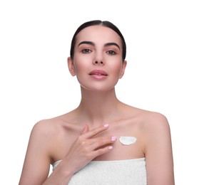 Photo of Beautiful woman with smear of body cream on her chest against white background