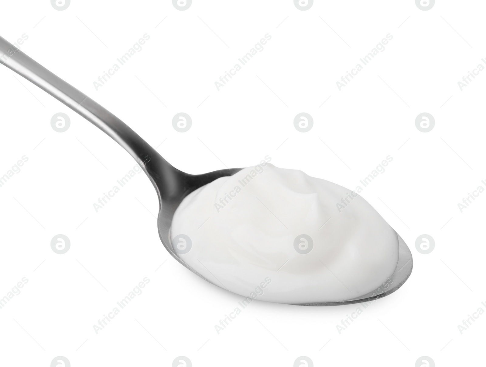 Photo of Delicious natural yogurt in spoon isolated on white