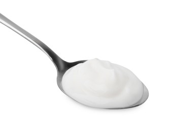 Delicious natural yogurt in spoon isolated on white