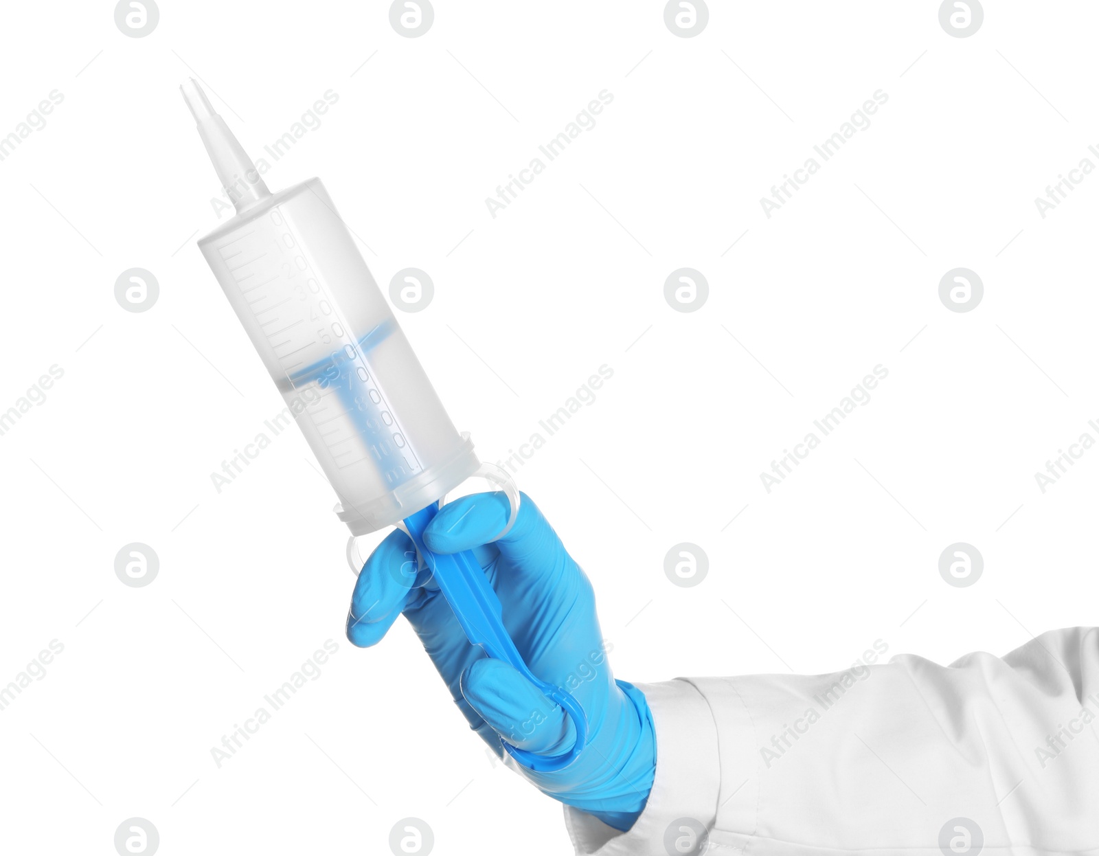 Photo of Doctor in medical glove holding large syringe on white background