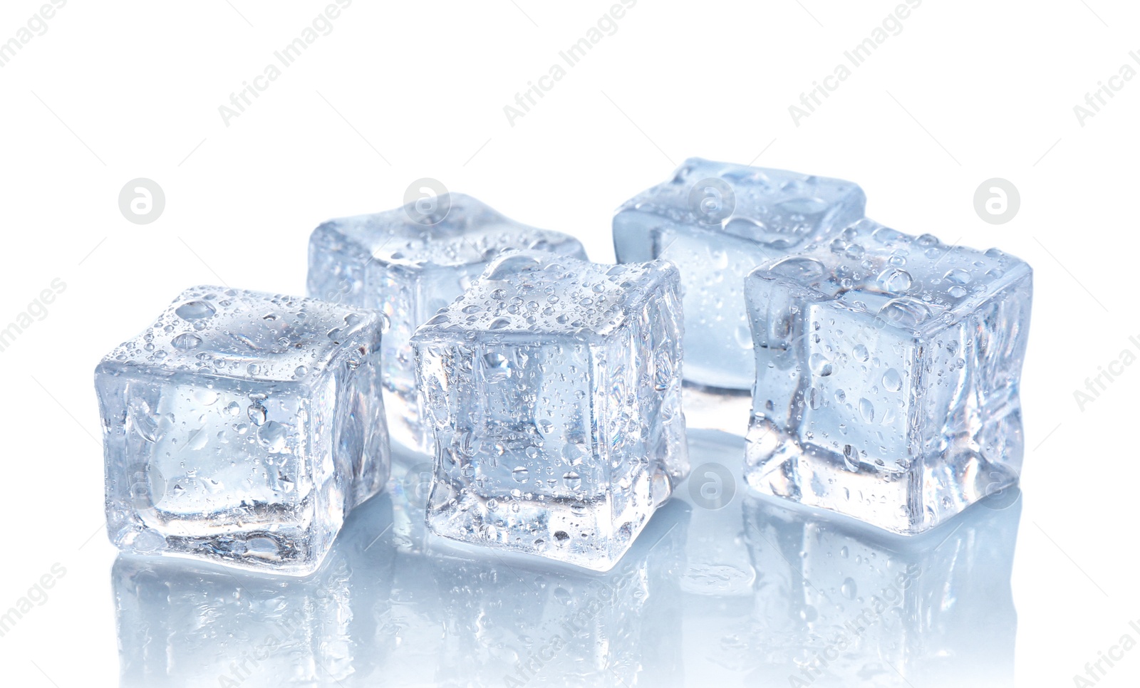 Photo of Crystal clear ice cubes with water drops isolated on white