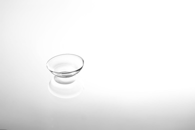 Photo of Contact lens on glass background