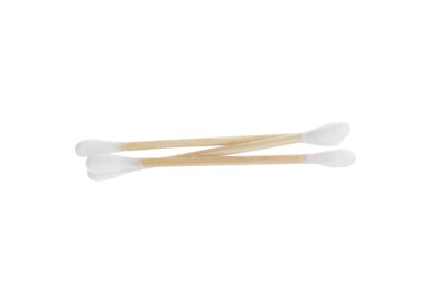 Photo of Wooden cotton buds on white background. Hygienic tool