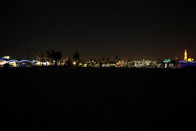 Photo of DUBAI, UNITED ARAB EMIRATES - NOVEMBER 03, 2018: Night landscape with illuminated city