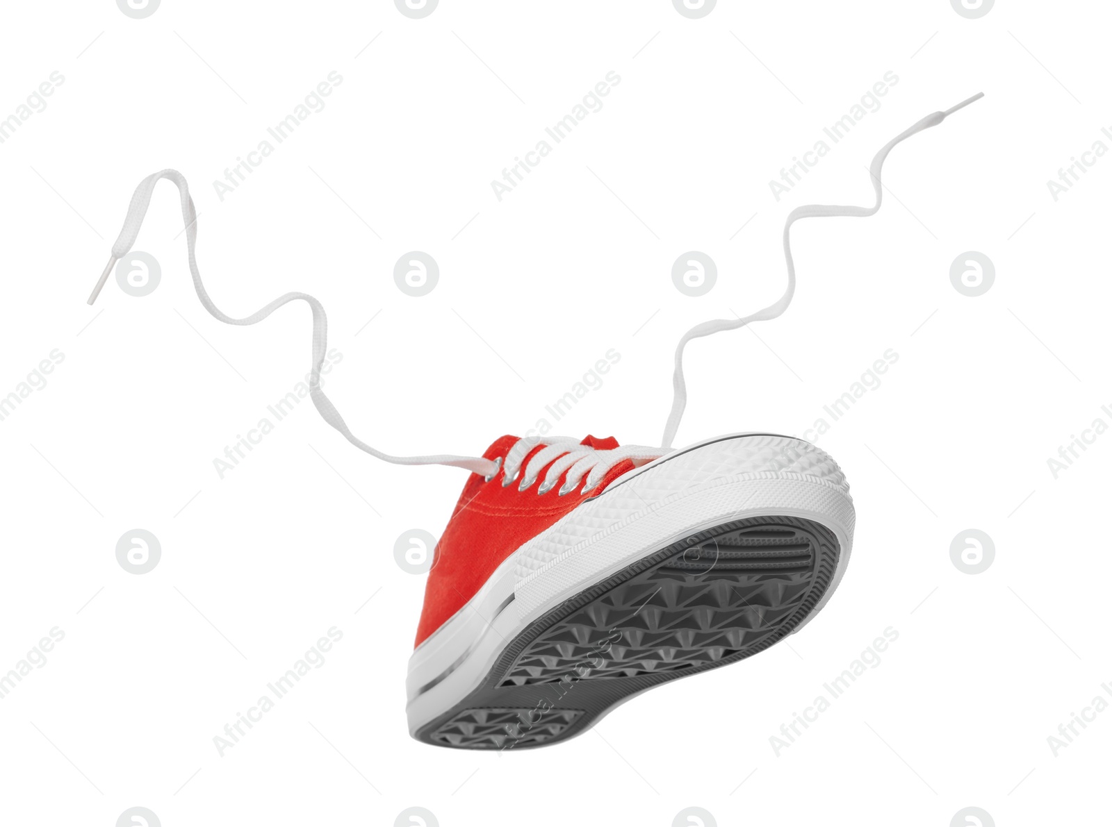 Photo of Red classic old school sneaker isolated on white