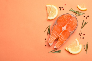 Photo of Flat lay composition with salmon steak on coral background. Space for text