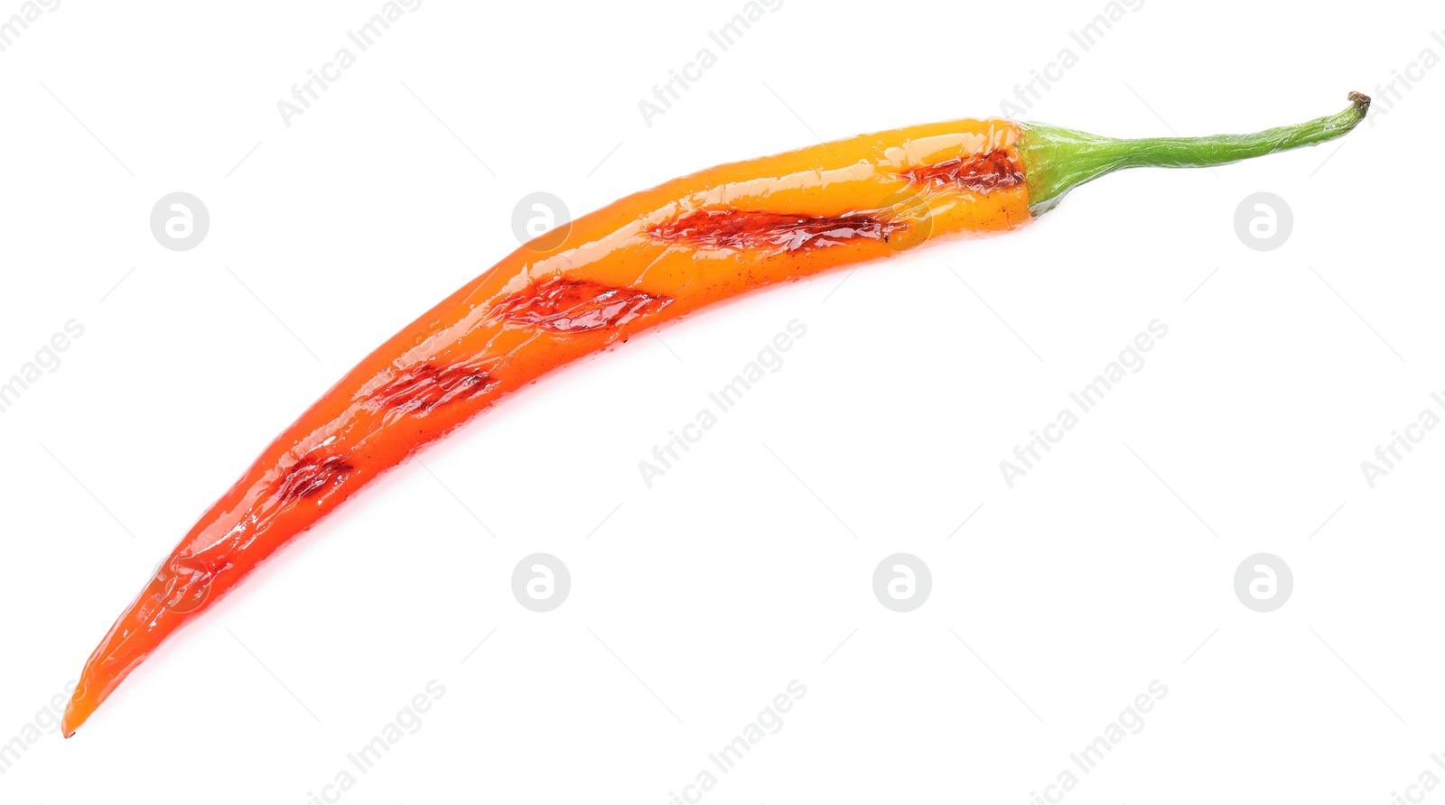 Photo of One grilled chili pepper isolated on white, top view