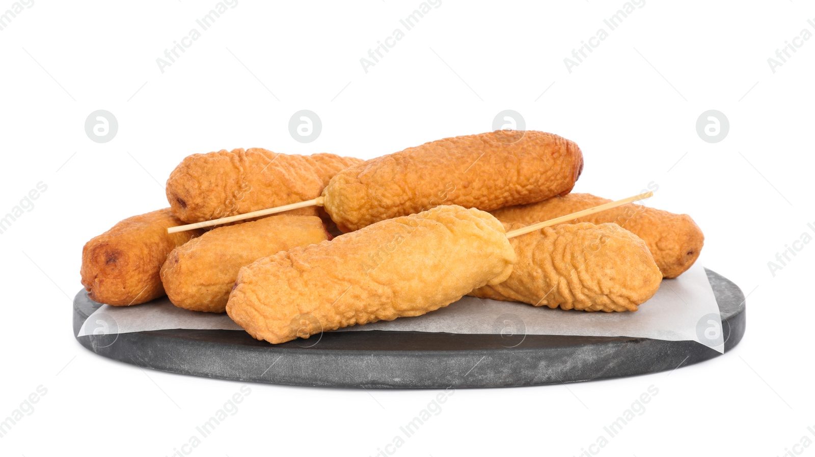 Photo of Delicious deep fried corn dogs with marble board isolated on white