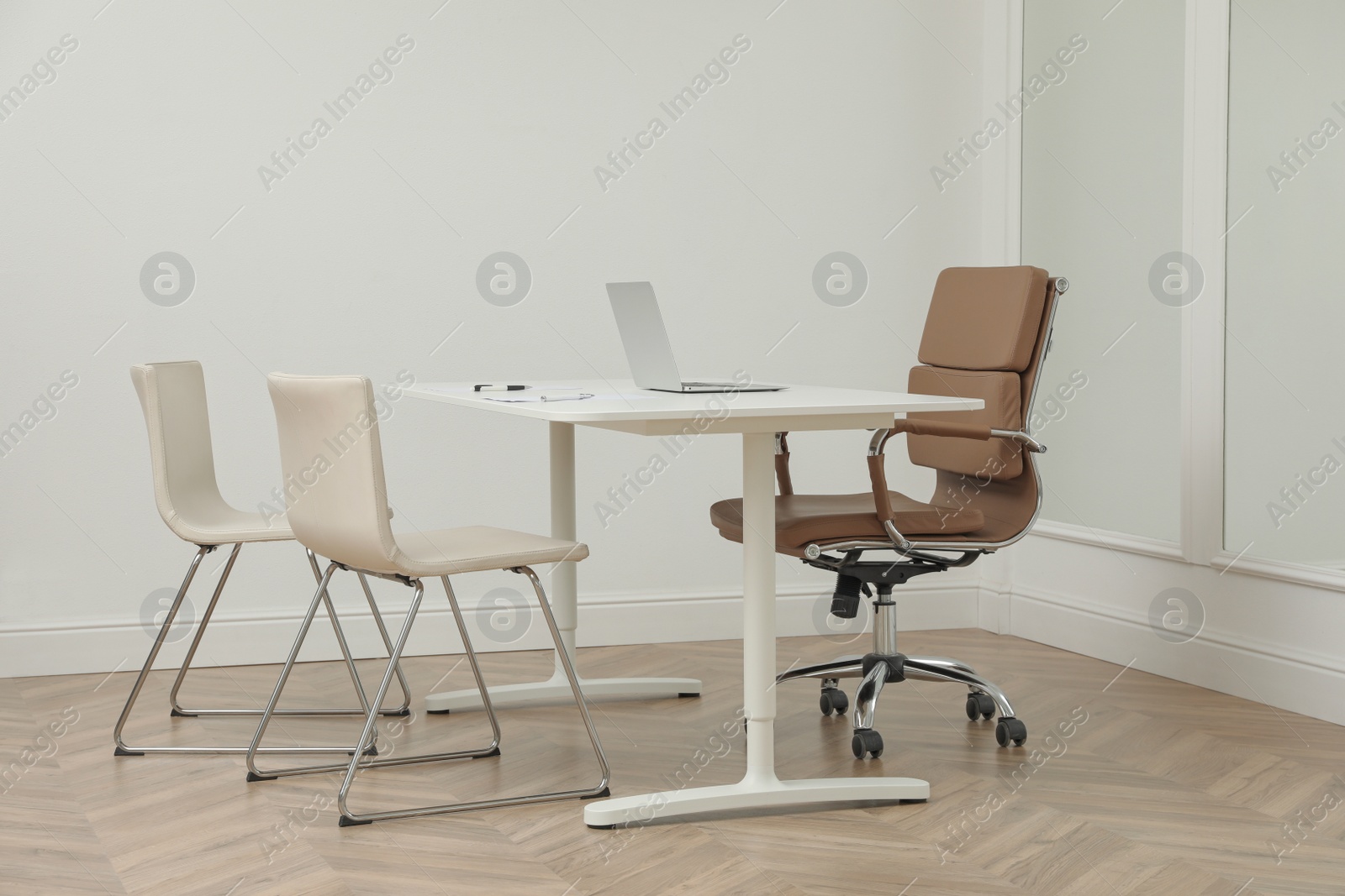 Photo of Director's office with large wooden table and comfortable chairs. Interior design