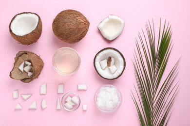 Flat lay composition with coconut oil on pink background