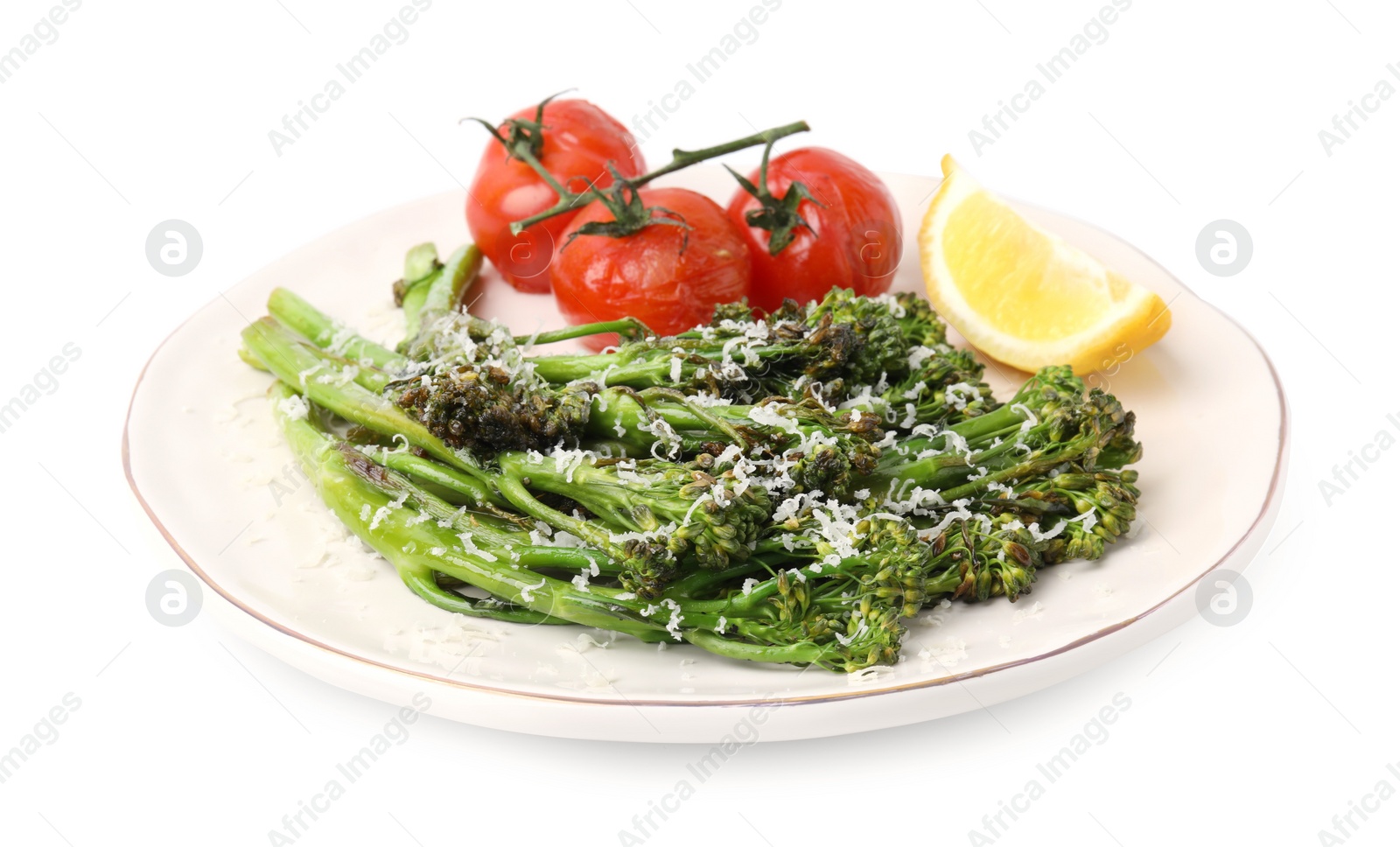 Photo of Tasty cooked broccolini with cheese, tomatoes and lemon isolated on white