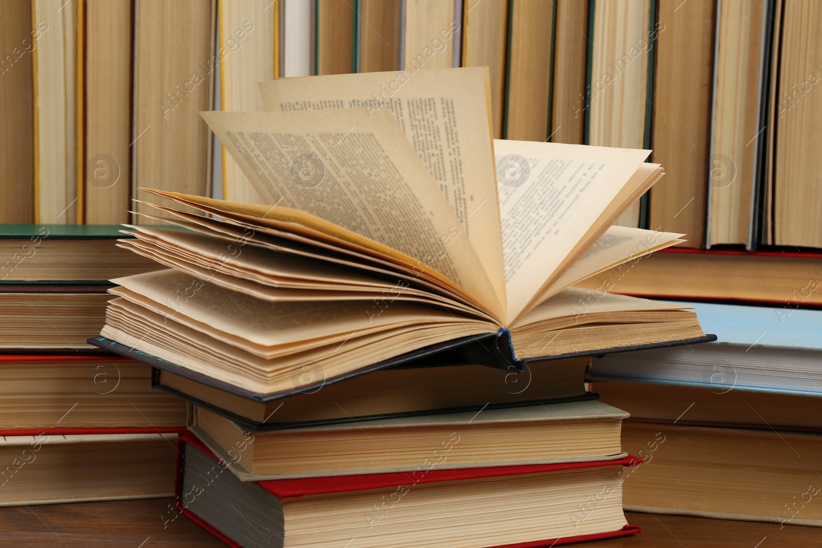 Photo of Many hardcover books as background, closeup. Library material