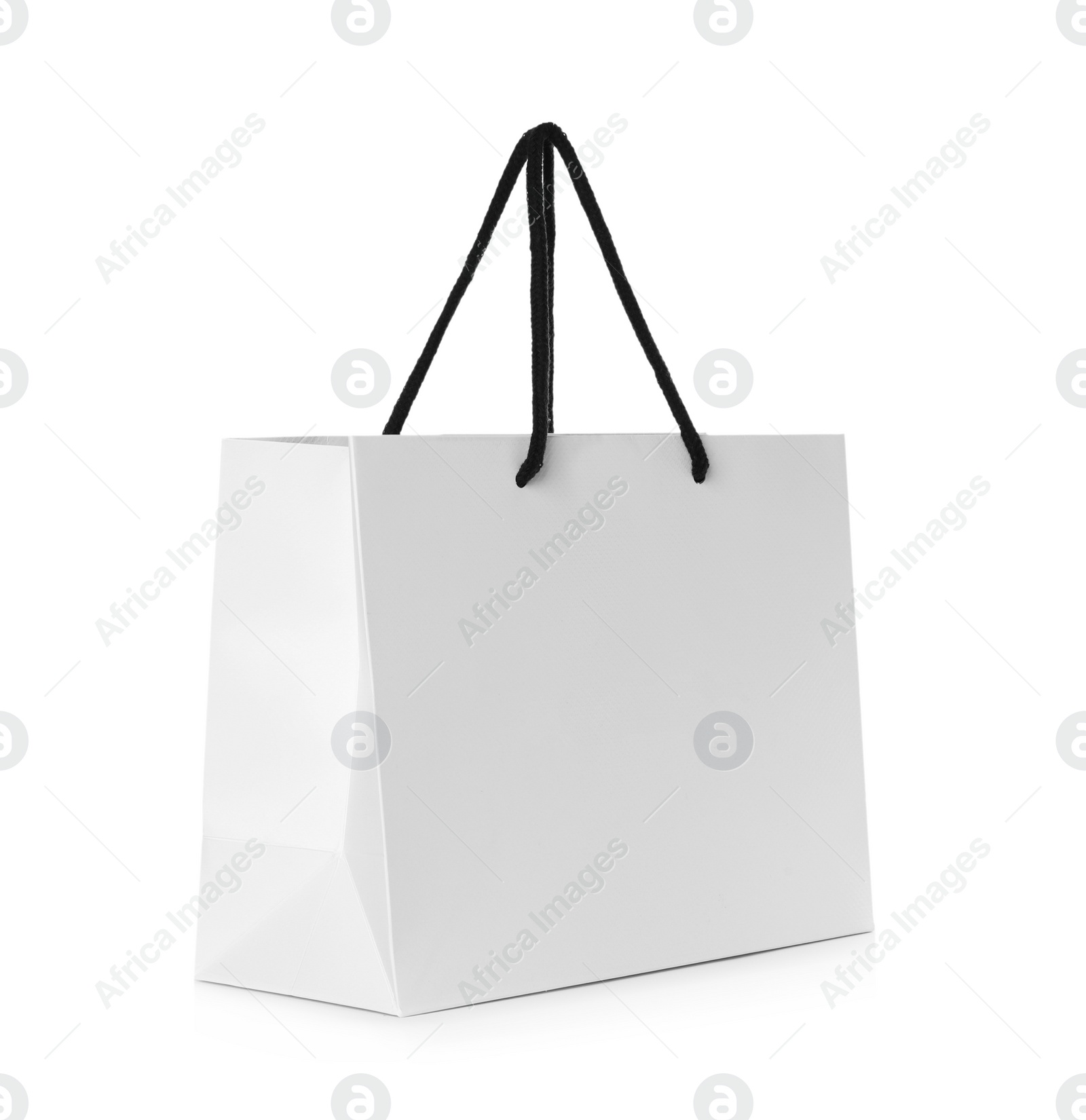 Photo of Paper shopping bag isolated on white. Mock up for design