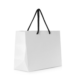 Photo of Paper shopping bag isolated on white. Mock up for design