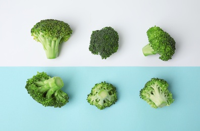 Photo of Flat lay composition with fresh green broccoli on color background