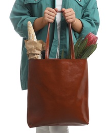 Photo of Woman holding leather shopper bag on white background, closeup