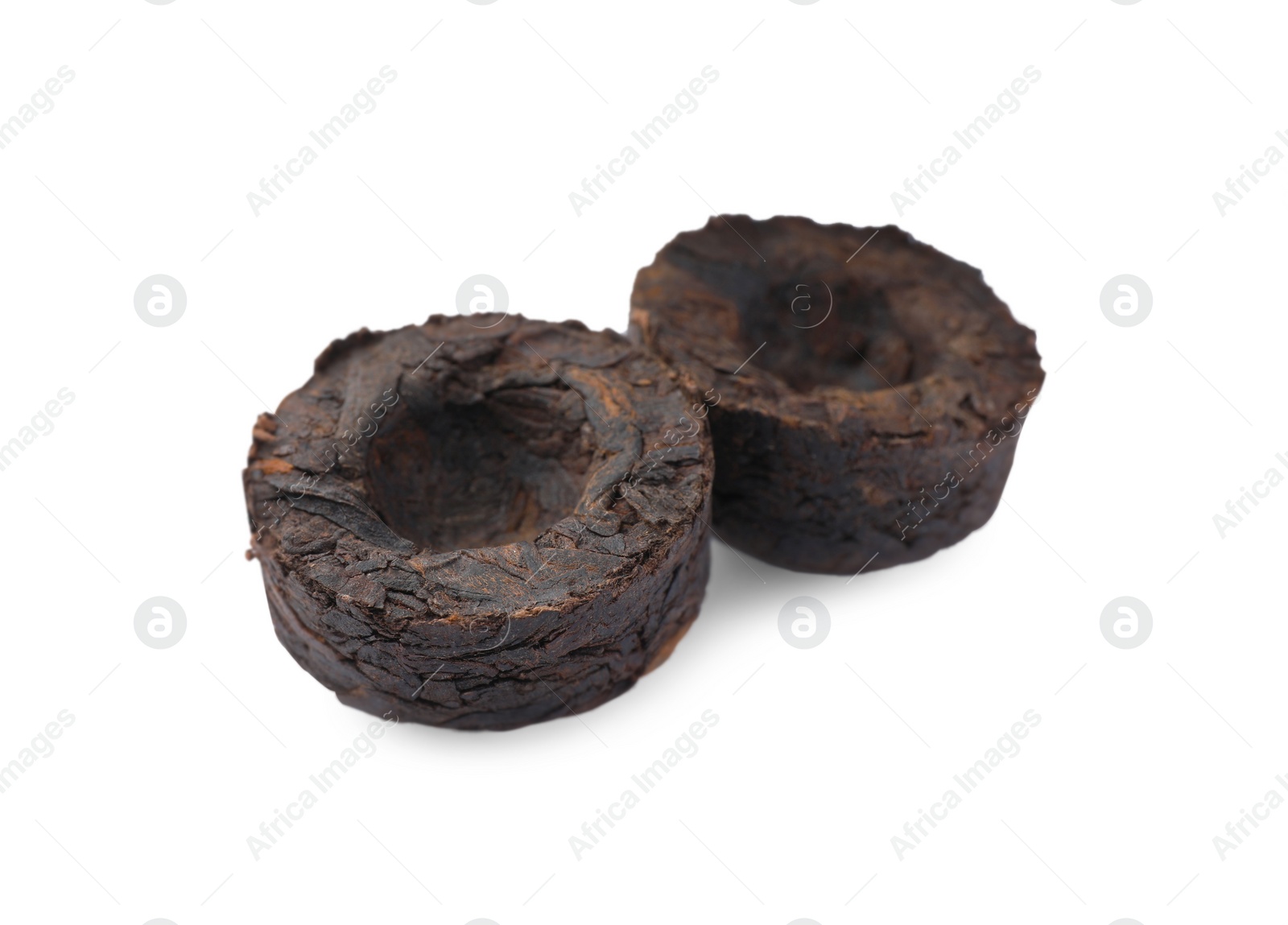 Photo of Cake shaped traditional Chinese pu-erh tea isolated on white