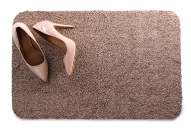 Photo of Stylish door mat with high heeled shoes on white background, top view