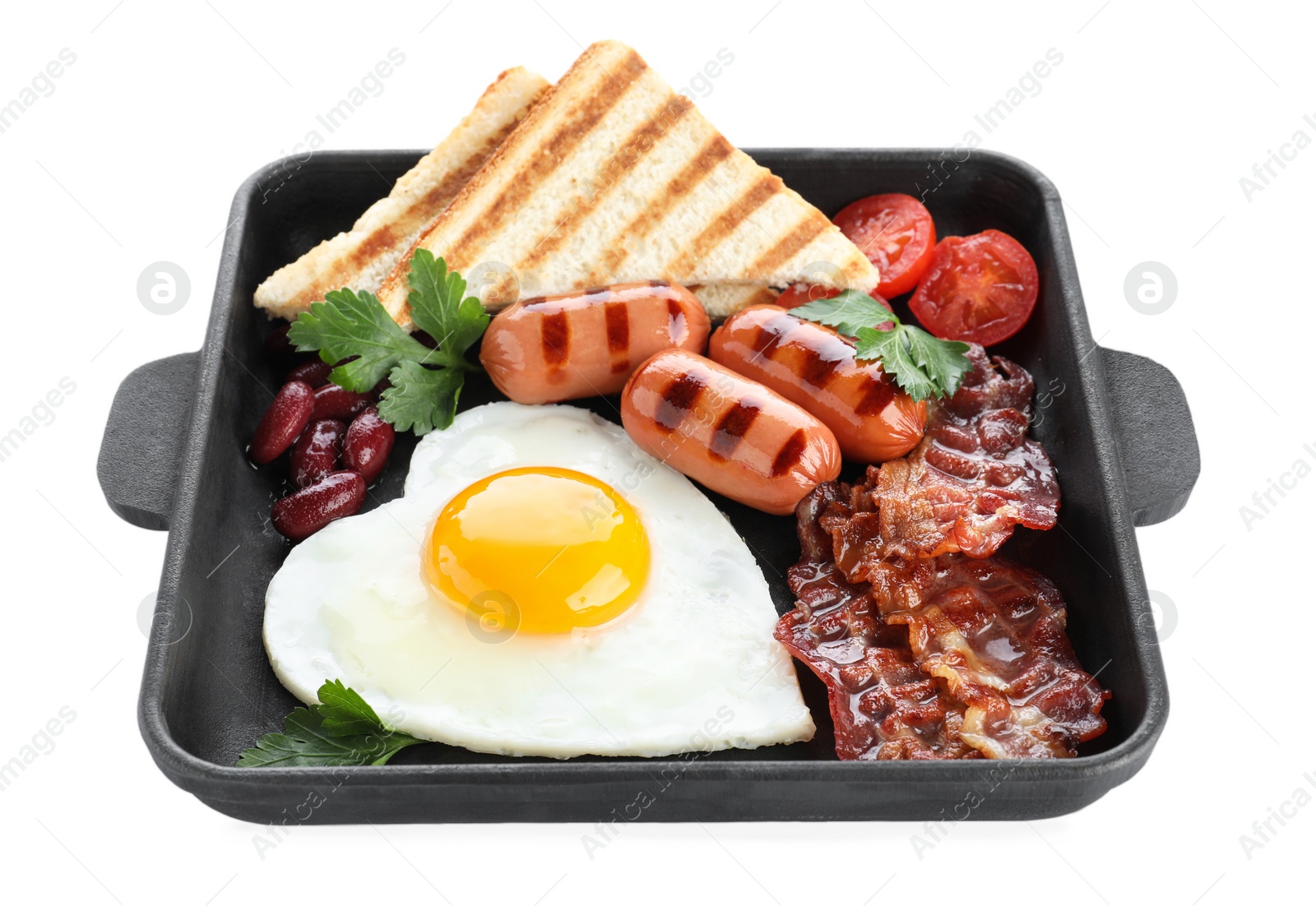 Photo of Frying pan of tasty breakfast with heart shaped egg and sausages isolated on white