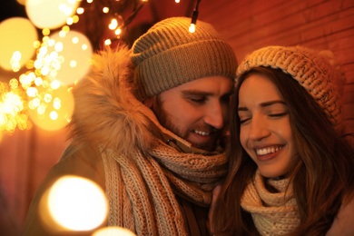 Photo of Happy couple spending time at Christmas fair