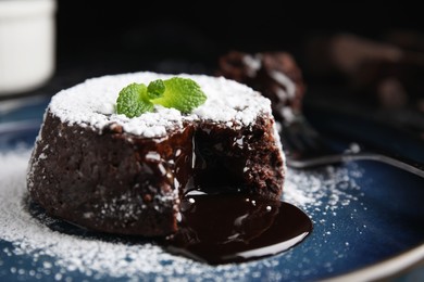 Photo of Delicious fresh fondant with hot chocolate and mint on plate, closeup