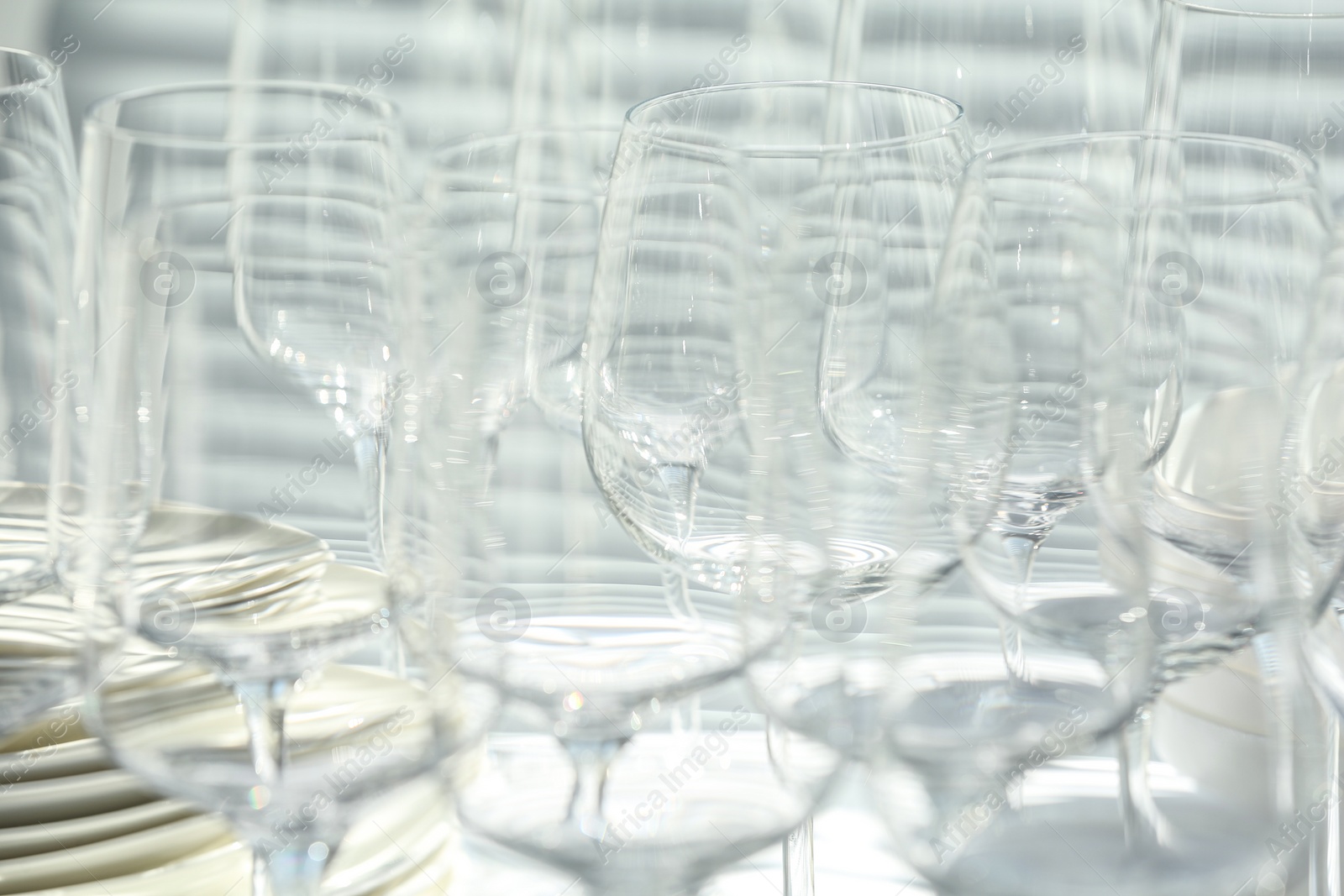 Photo of Set of empty wine glasses on table, closeup