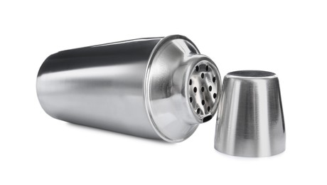 Photo of Metal cocktail shaker and cup isolated on white