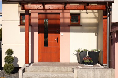 Photo of House with wooden door, view from outside. Exterior design
