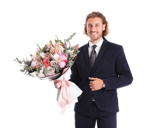 Photo of Young handsome man in stylish suit with beautiful flower bouquet on white background