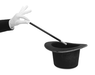 Image of Magician showing trick with wand and top hat on white background, closeup