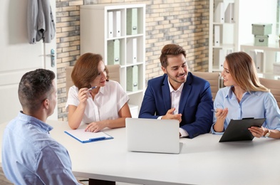 Photo of Human resources commission conducting job interview with applicant in office